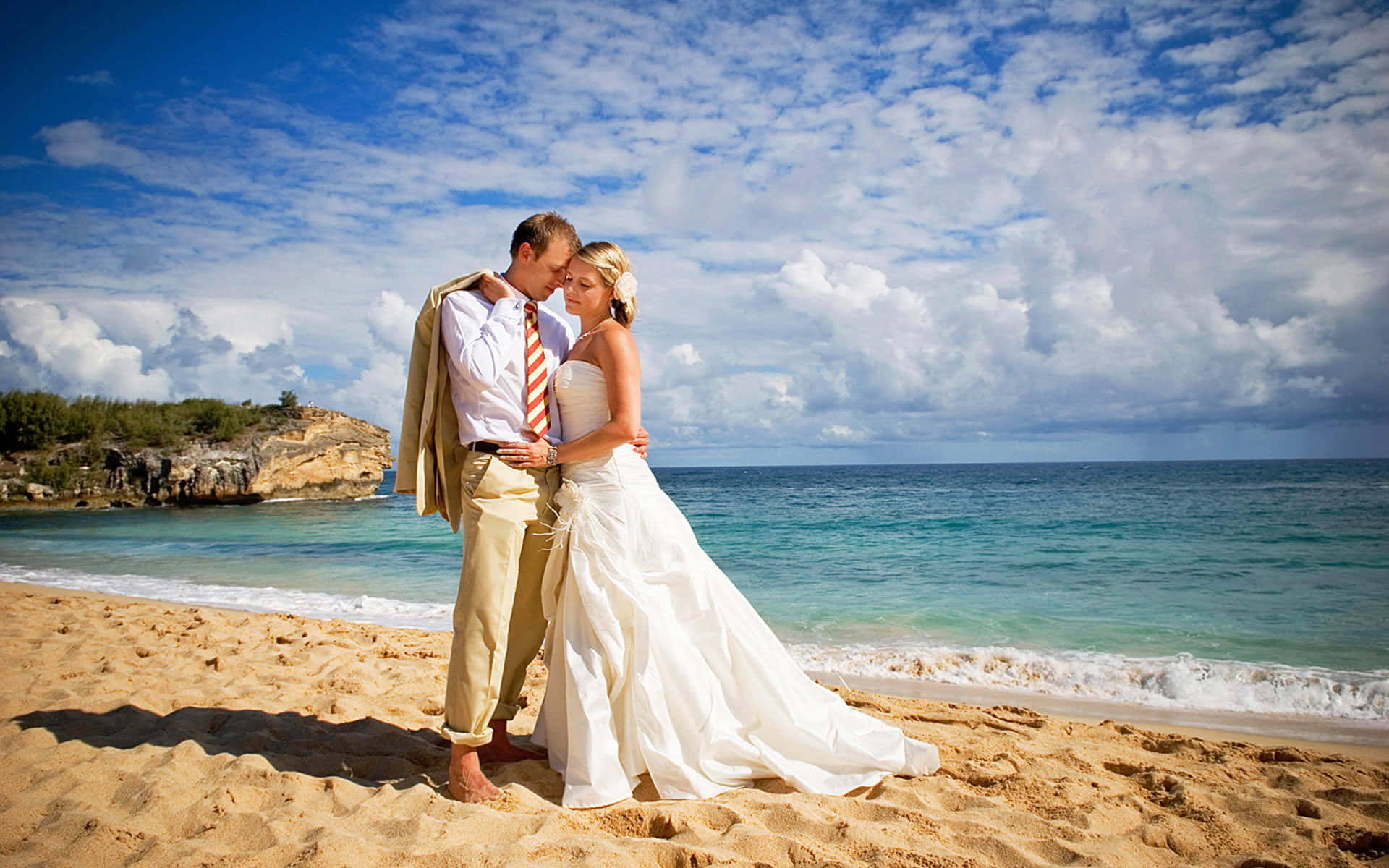 "a Perfect Moment Of Bliss - Couple Tying The Knot On A Stunning Beach At Sunset" Wallpaper