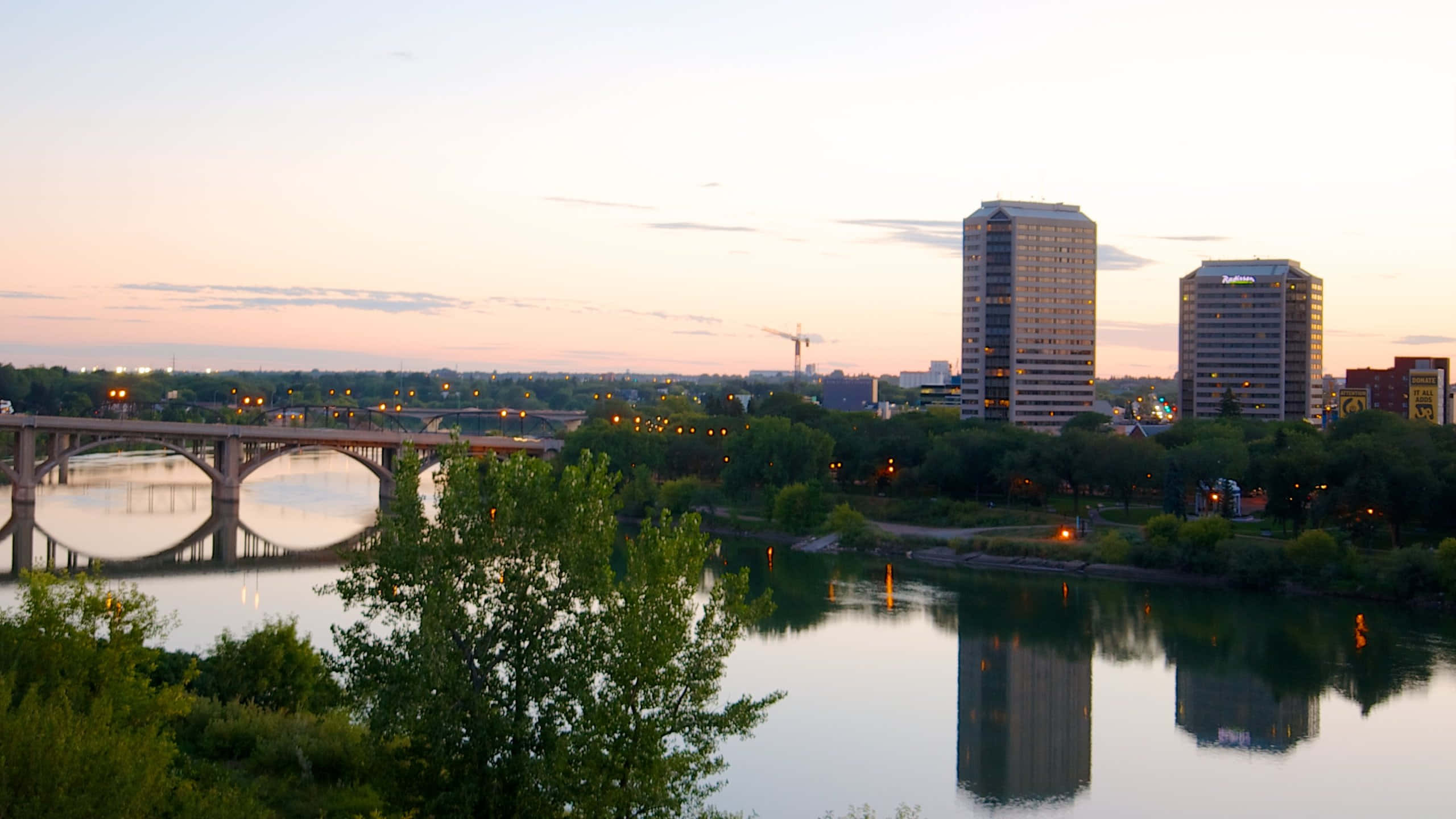 "a Picturesque Sunrise Over Saskatoon's Cityscape." Wallpaper