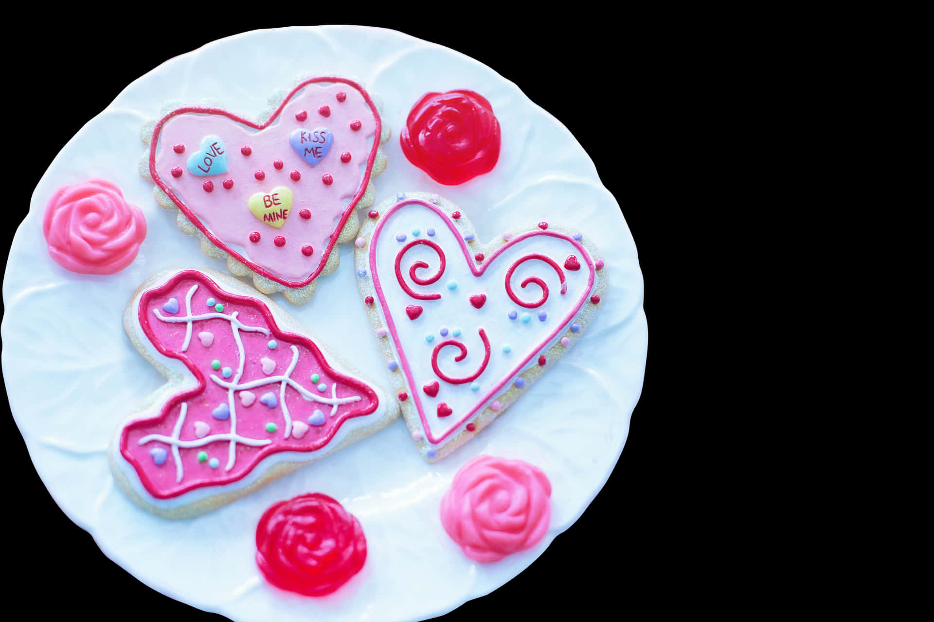 Download A Plate Of Cookies With Pink Frosting | Wallpapers.com