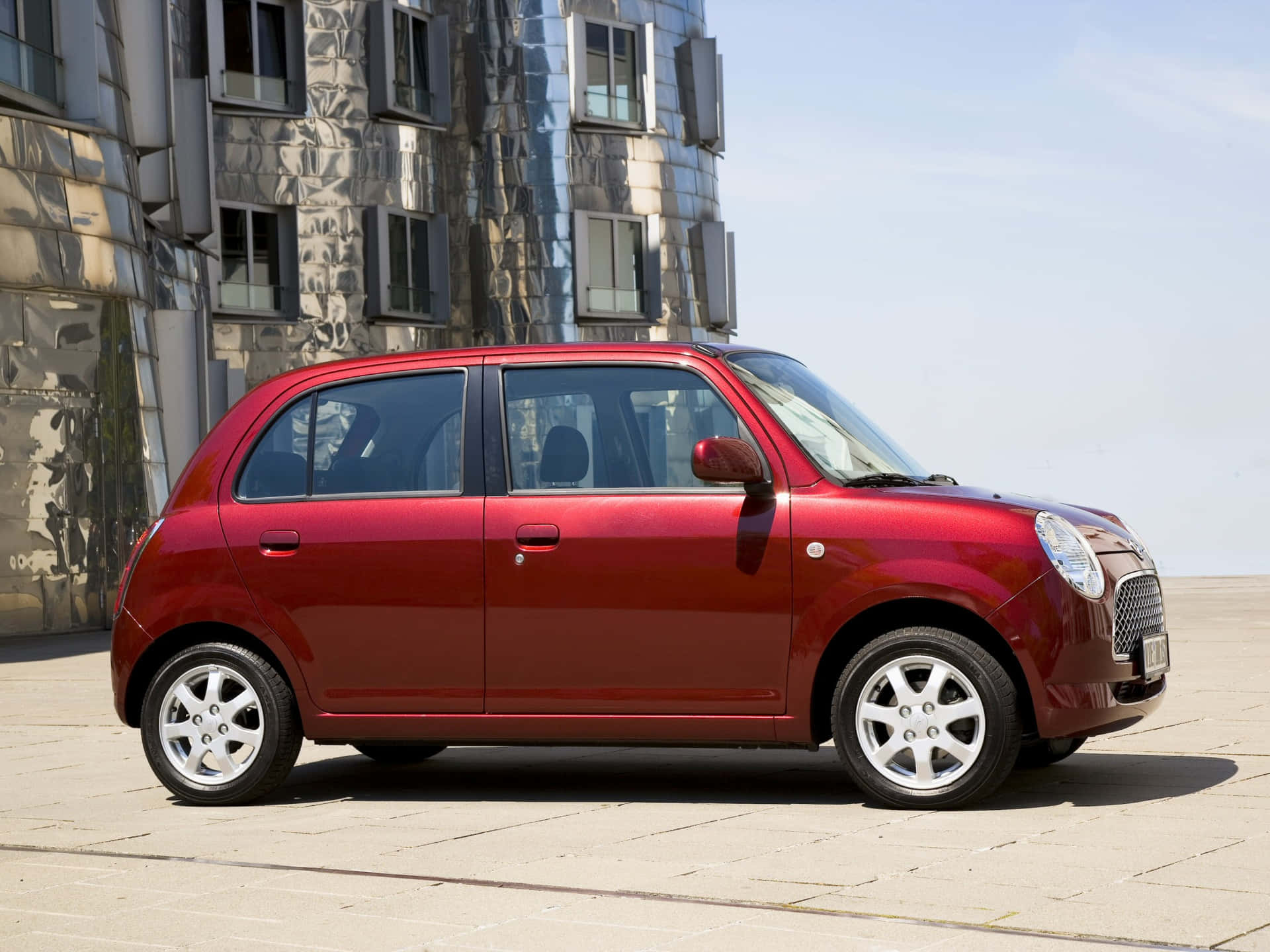 A Polished Daihatsu Trevis Parked Down The Street. Wallpaper