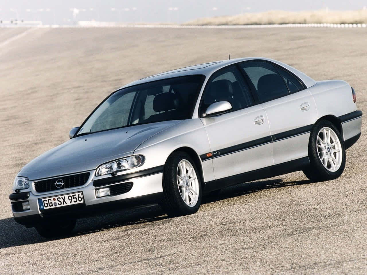 A Pristine Opel Omega B Model In Dynamic Motion Wallpaper