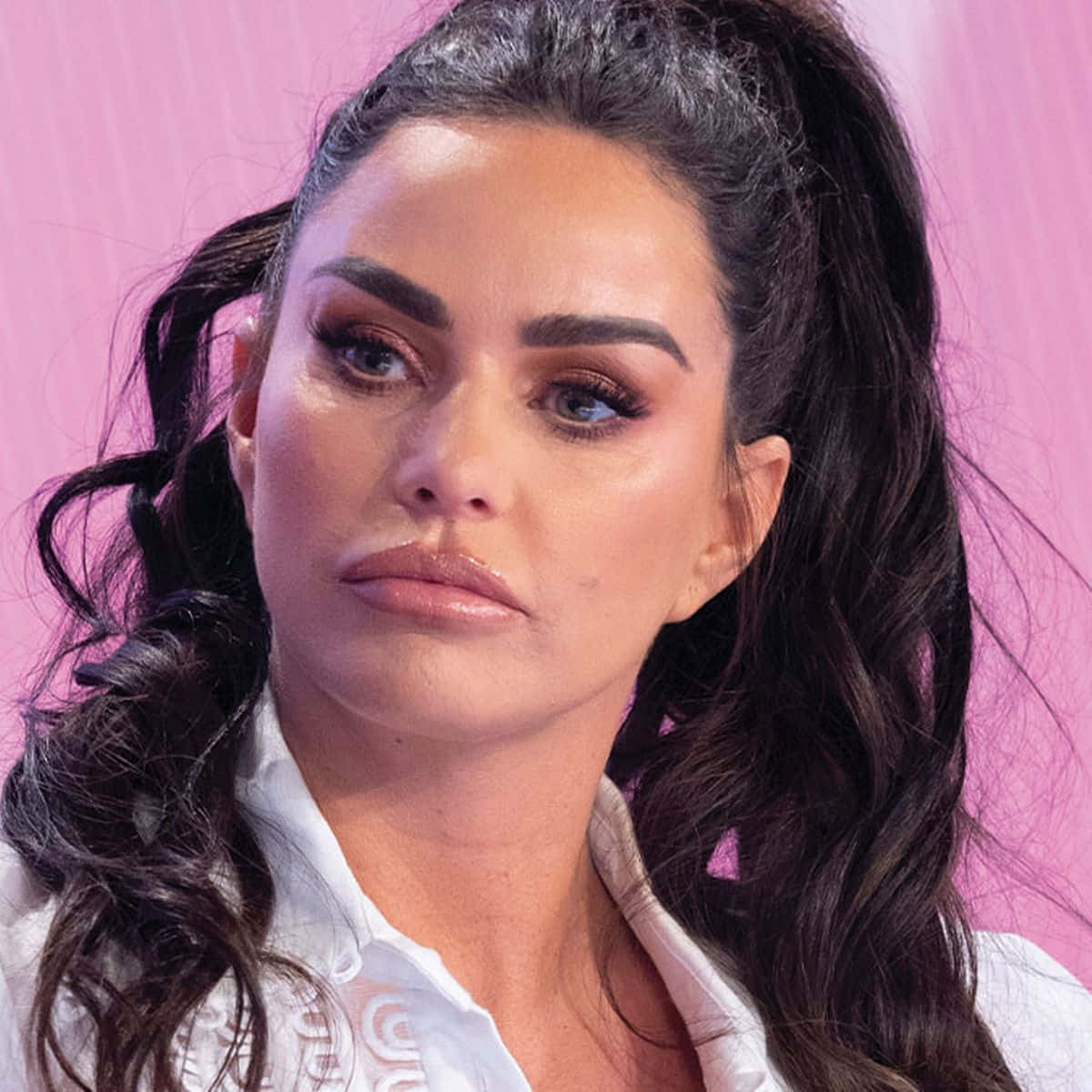 A Radiant Katie Price Posing Confidently Wallpaper