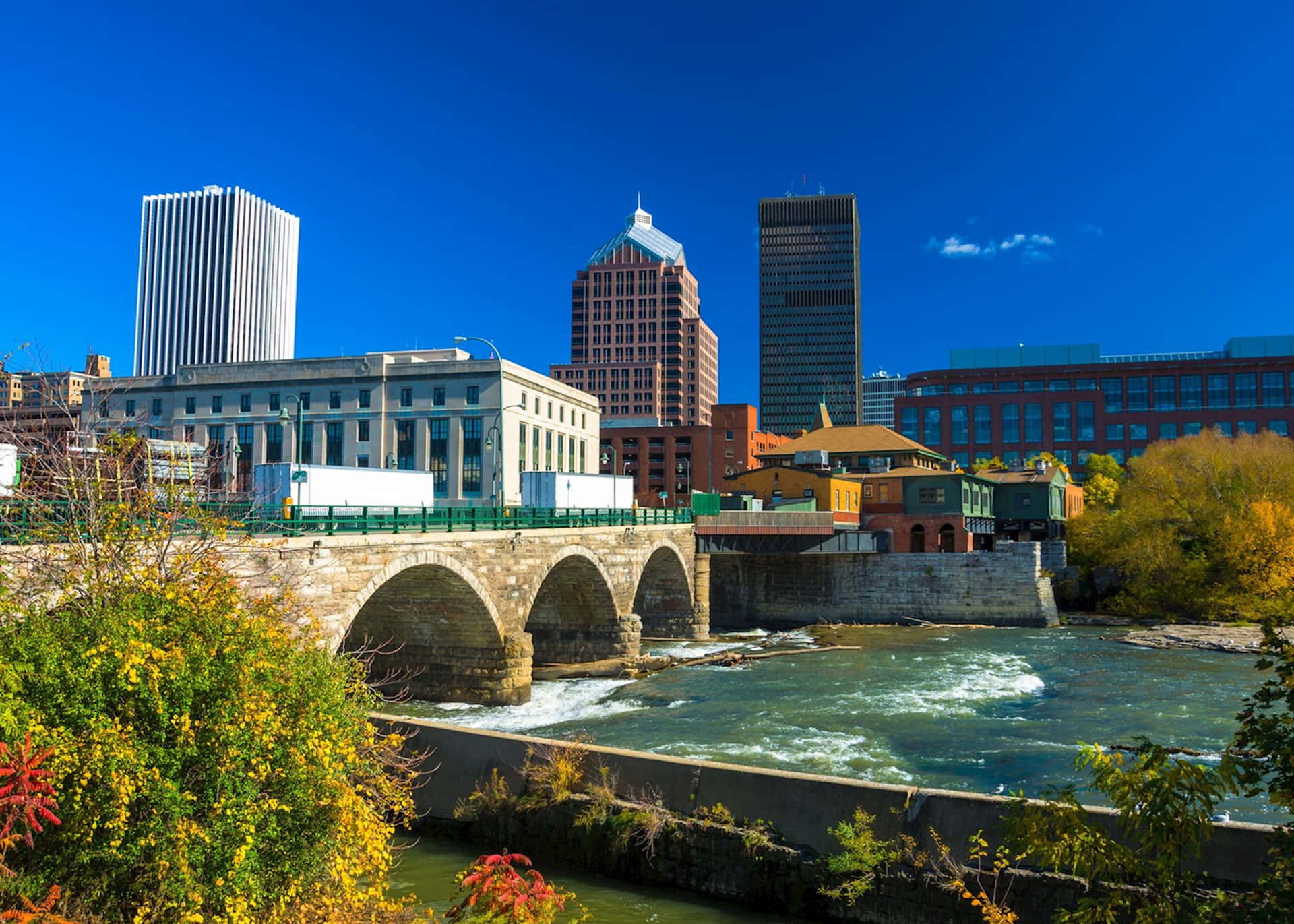 A Scenic View Of Downtown Rochester In The Warm Glow Of The Sunset Wallpaper