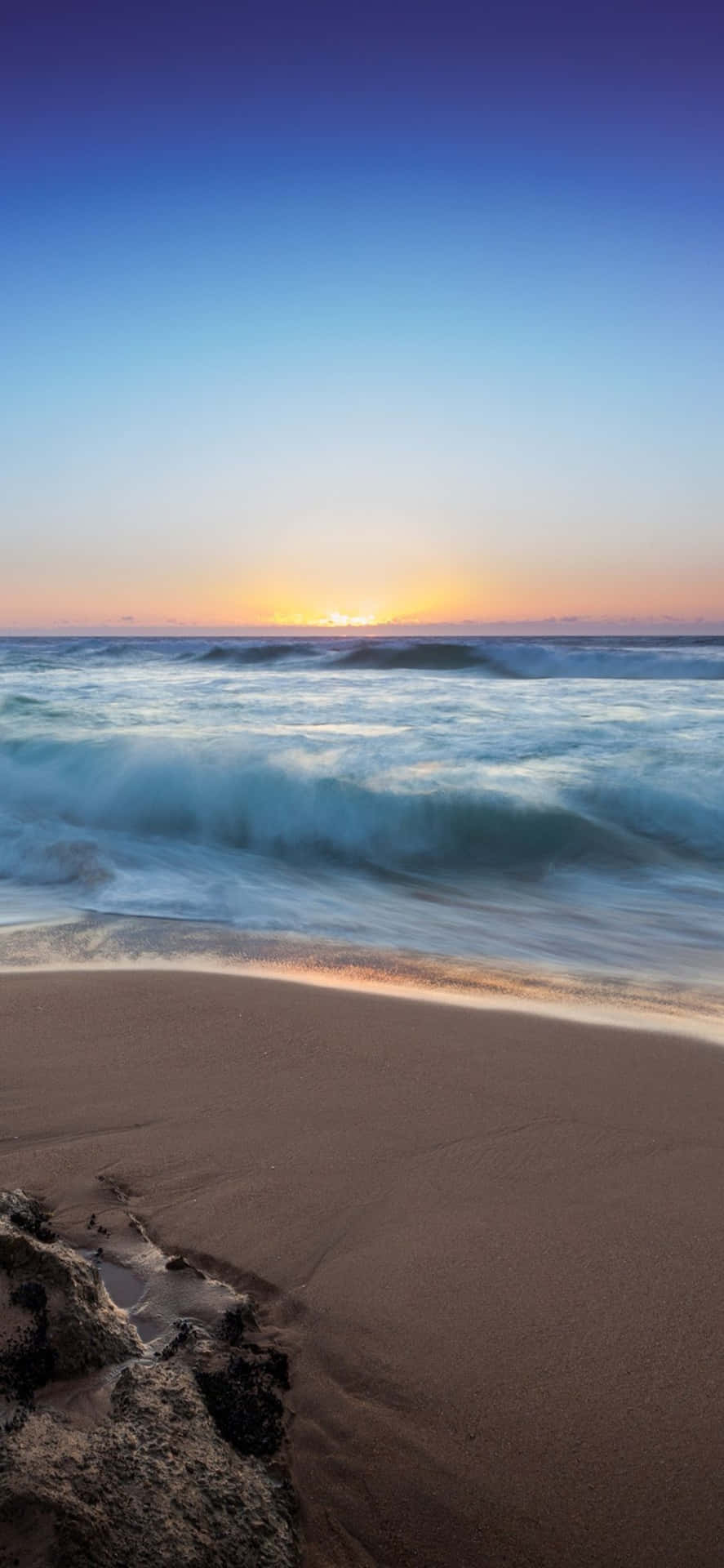 A Serene Iphone X Wallpaper Capturing The Beauty Of The Beach