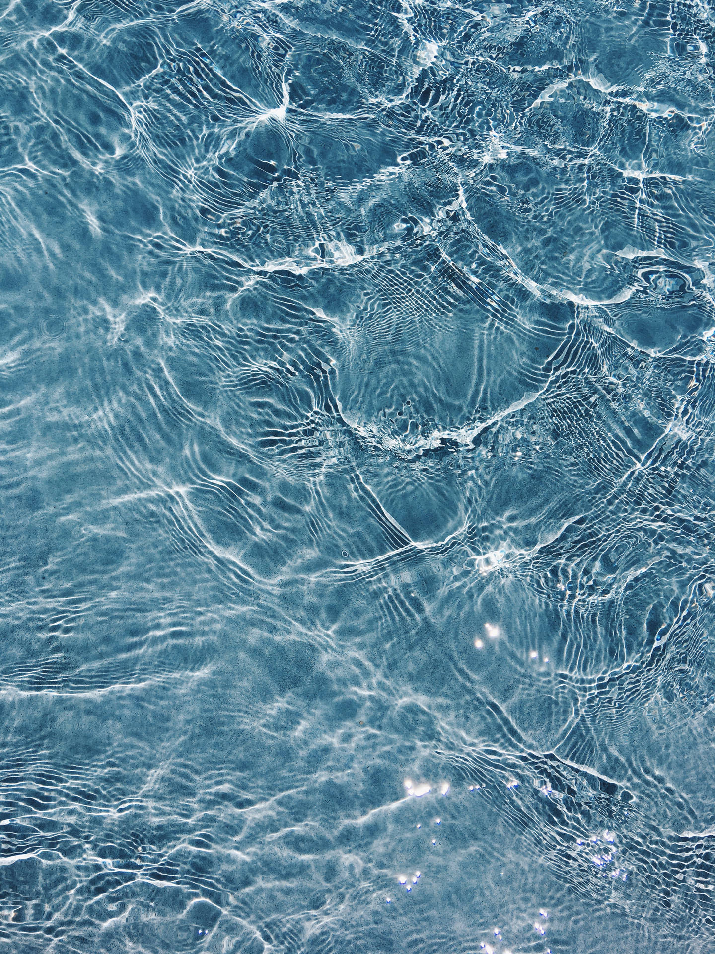 Discover inner contemplation and serenity in a rippling pool of water. Wallpaper