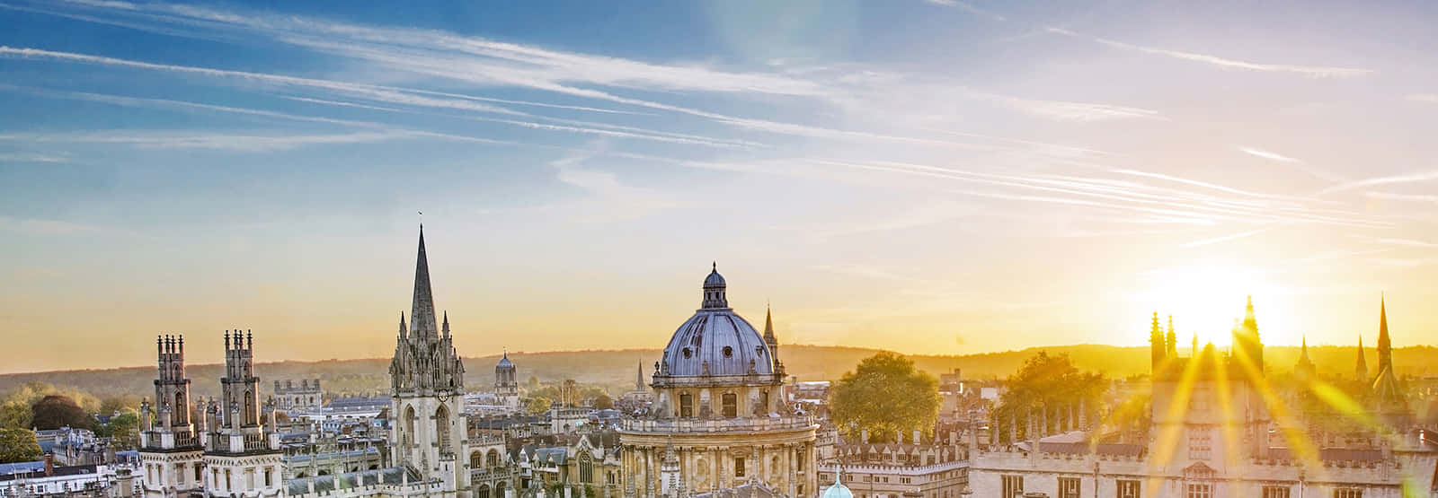 A Serene View Of Oxford City Skyline At Sunset Wallpaper