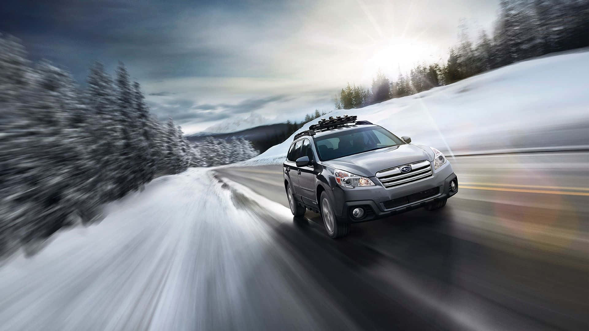 A Silver Subaru Outback Parked In The Wild Wallpaper