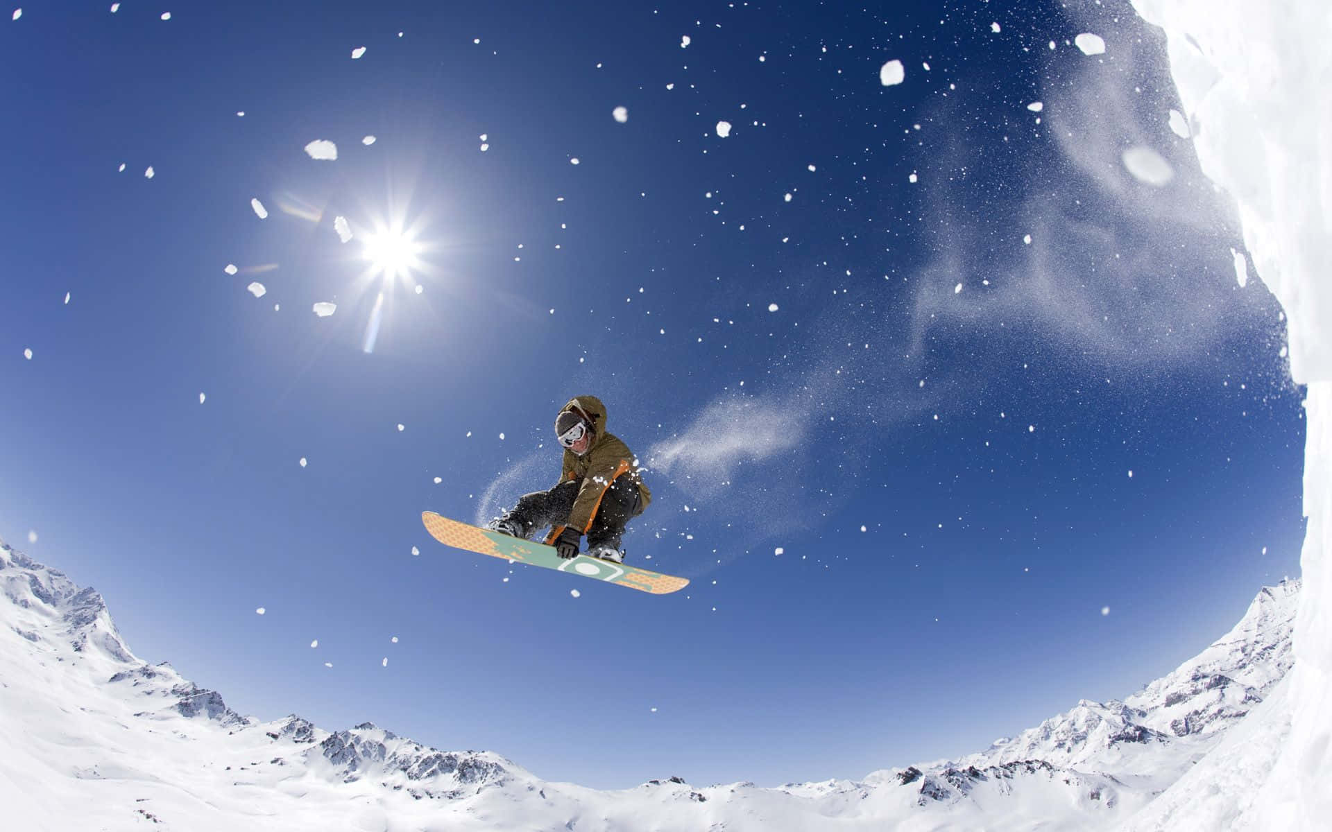 A Skier In Motion On A Pristine Snowy Slope Wallpaper