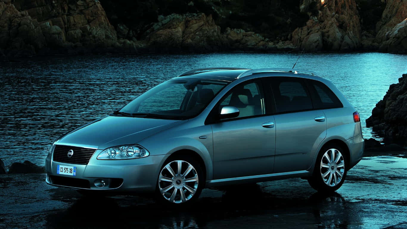 A Sleek And Stylish Fiat Croma On An Open Road. Wallpaper