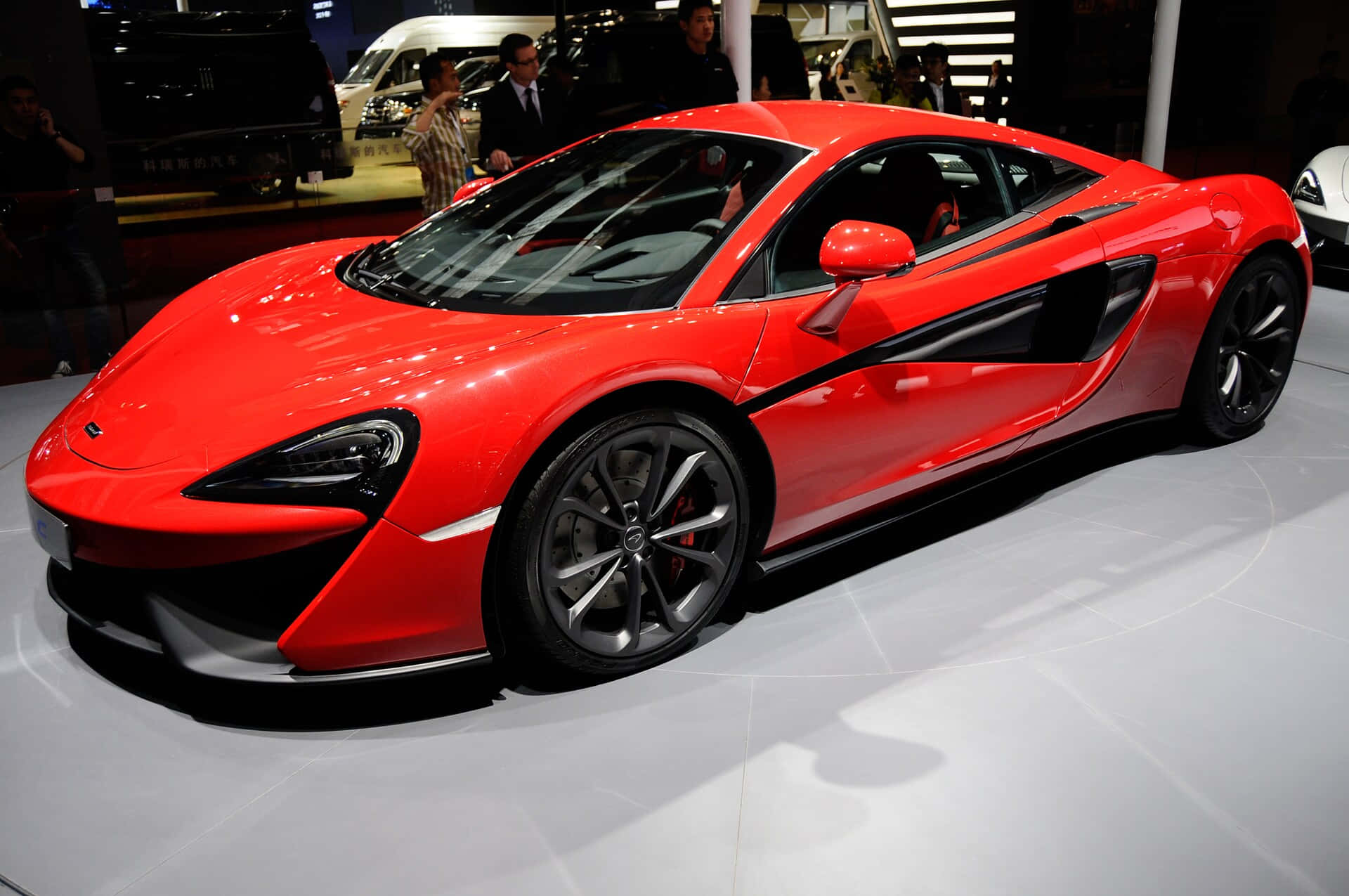 A Sleek Mclaren 540c On The Edge Of Wilderness Wallpaper