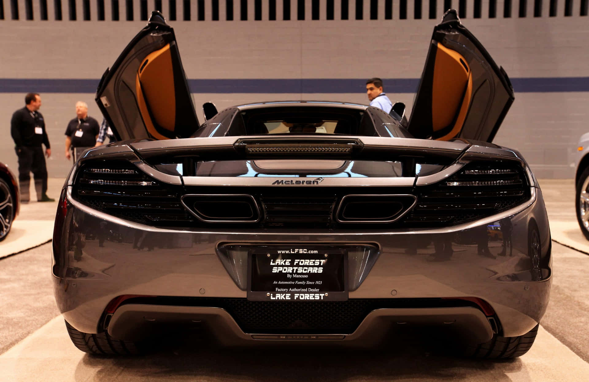 A Sleek Mclaren Mp4-12c In Its Entirety Wallpaper