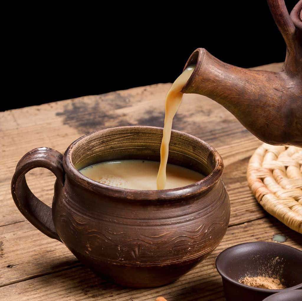 A Steaming Cup Of Traditional Indian Chai Tea. Wallpaper