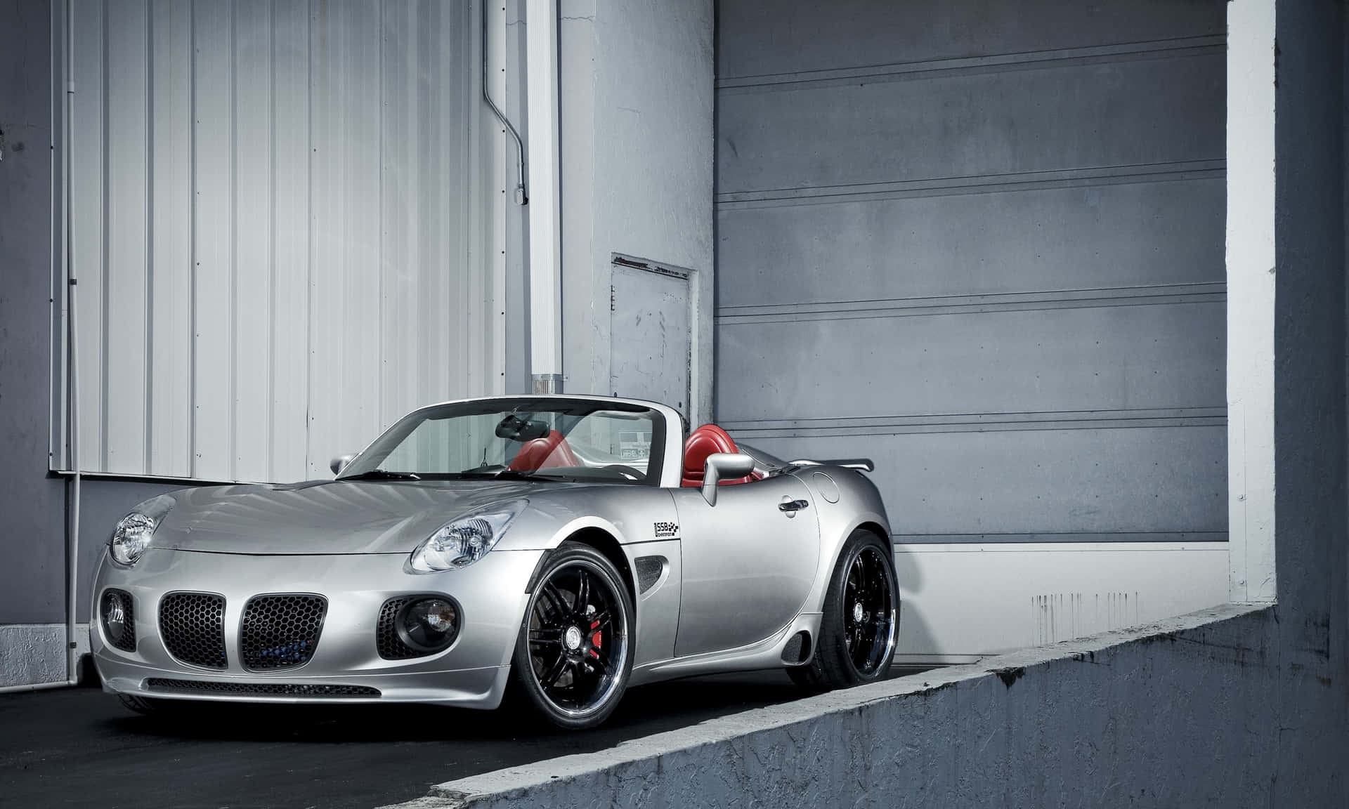 "a Stunning Pontiac Solstice On The Open Road" Wallpaper