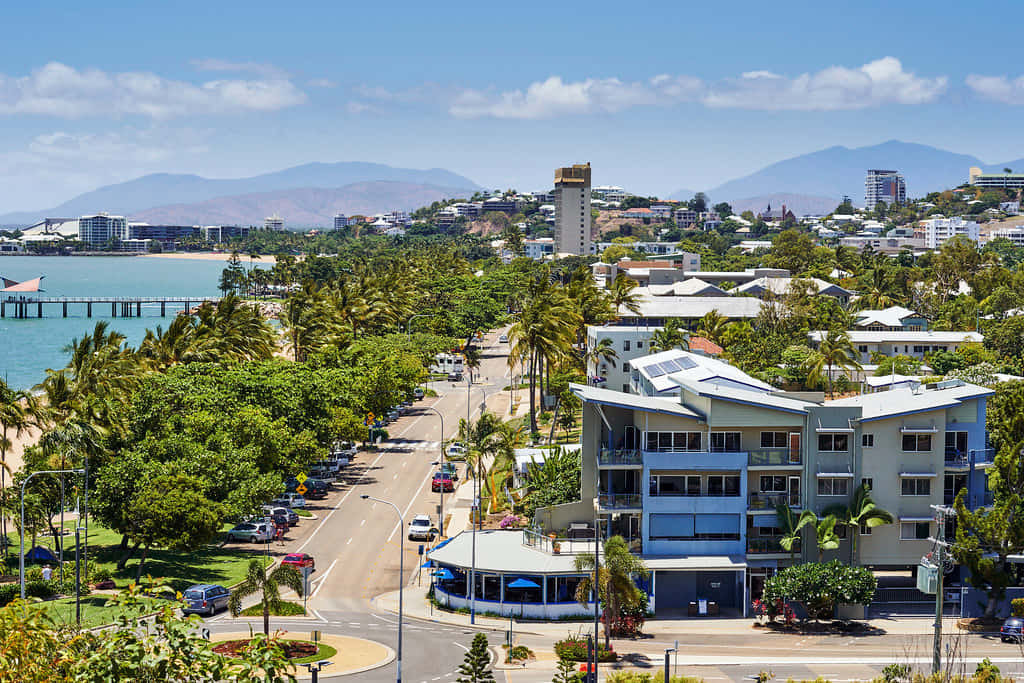 A Stunning View Of The Strand In Townsville, Overlooking Magnetic Island. Magnetic Island And The Turquoise Water Under The Queensland Sun. Wallpaper