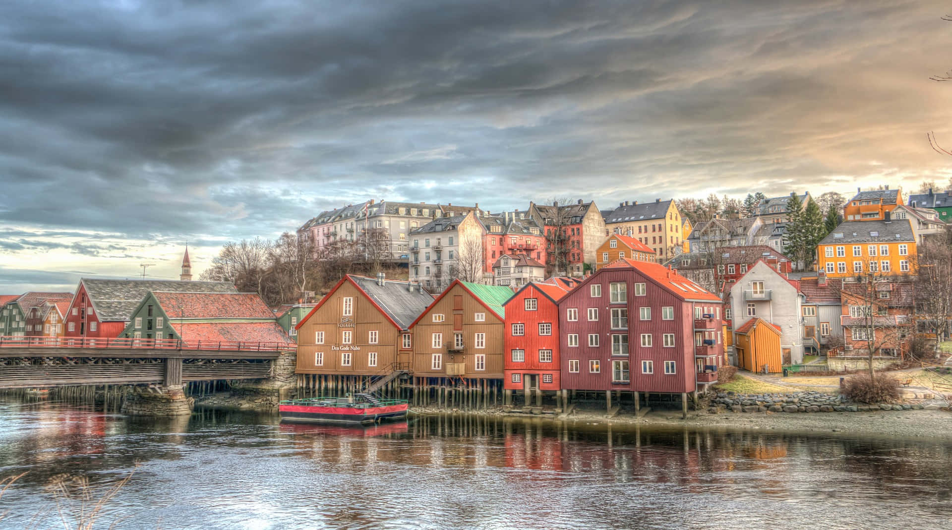 A Stunning View Of Trondheim Cityscape In Sunset Wallpaper