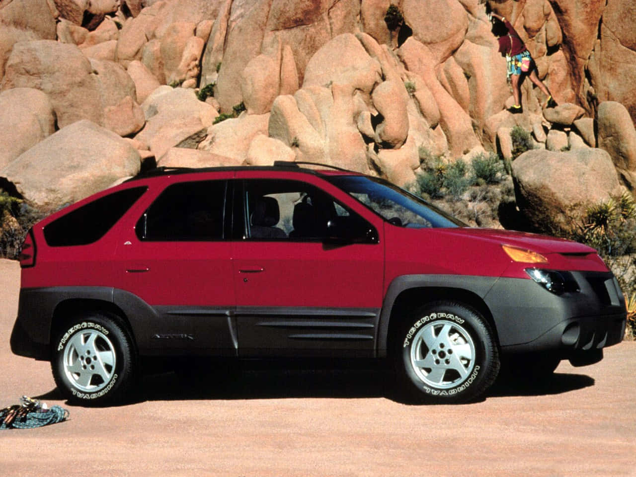 A Stylish And Shiny Pontiac Aztek On The Road Wallpaper