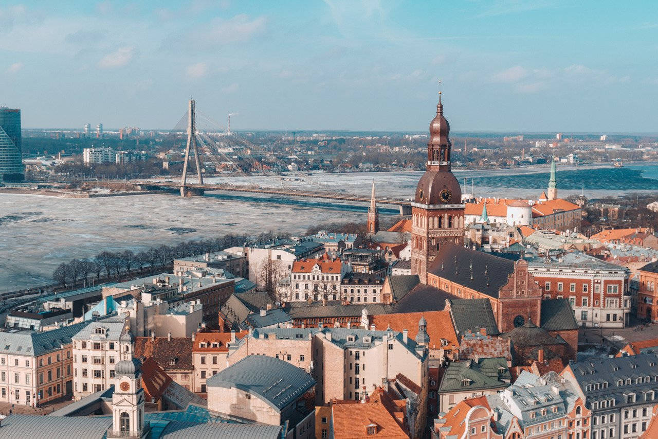 A Sunset View Of The Riga City Skyline Wallpaper