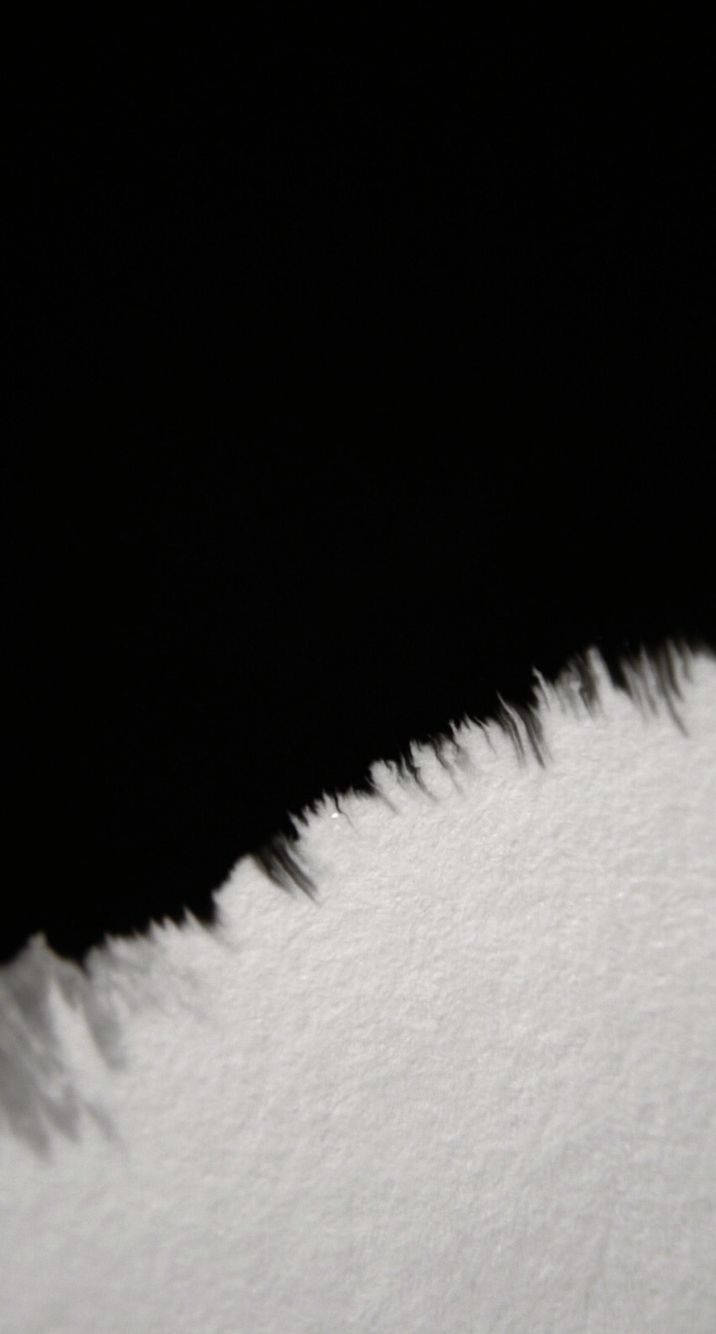 A Surface Split By Black Smudges Wallpaper