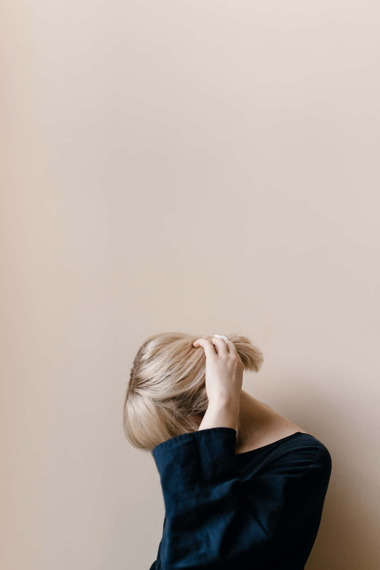 A Timid Blonde Girl In Deep Thought Wallpaper