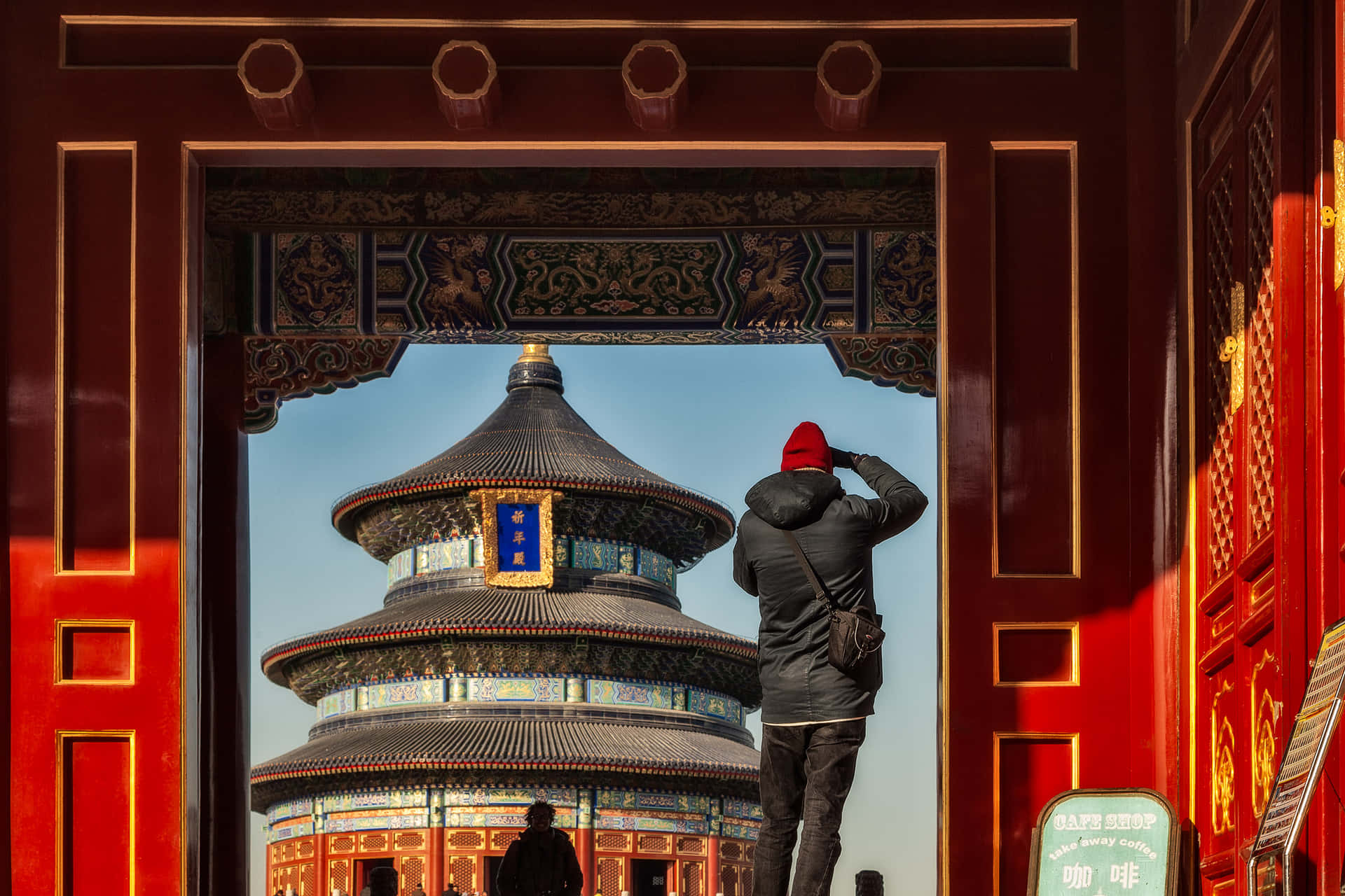 A Tourist Standing At The Temple Of Heaven's North Hall Wallpaper