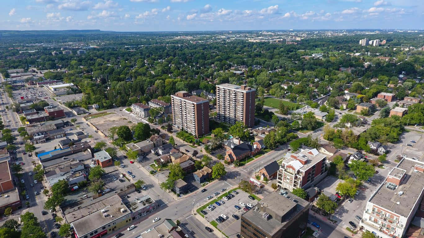 Een Transcendente Zonsondergang Over De Burlington Skyline Achtergrond