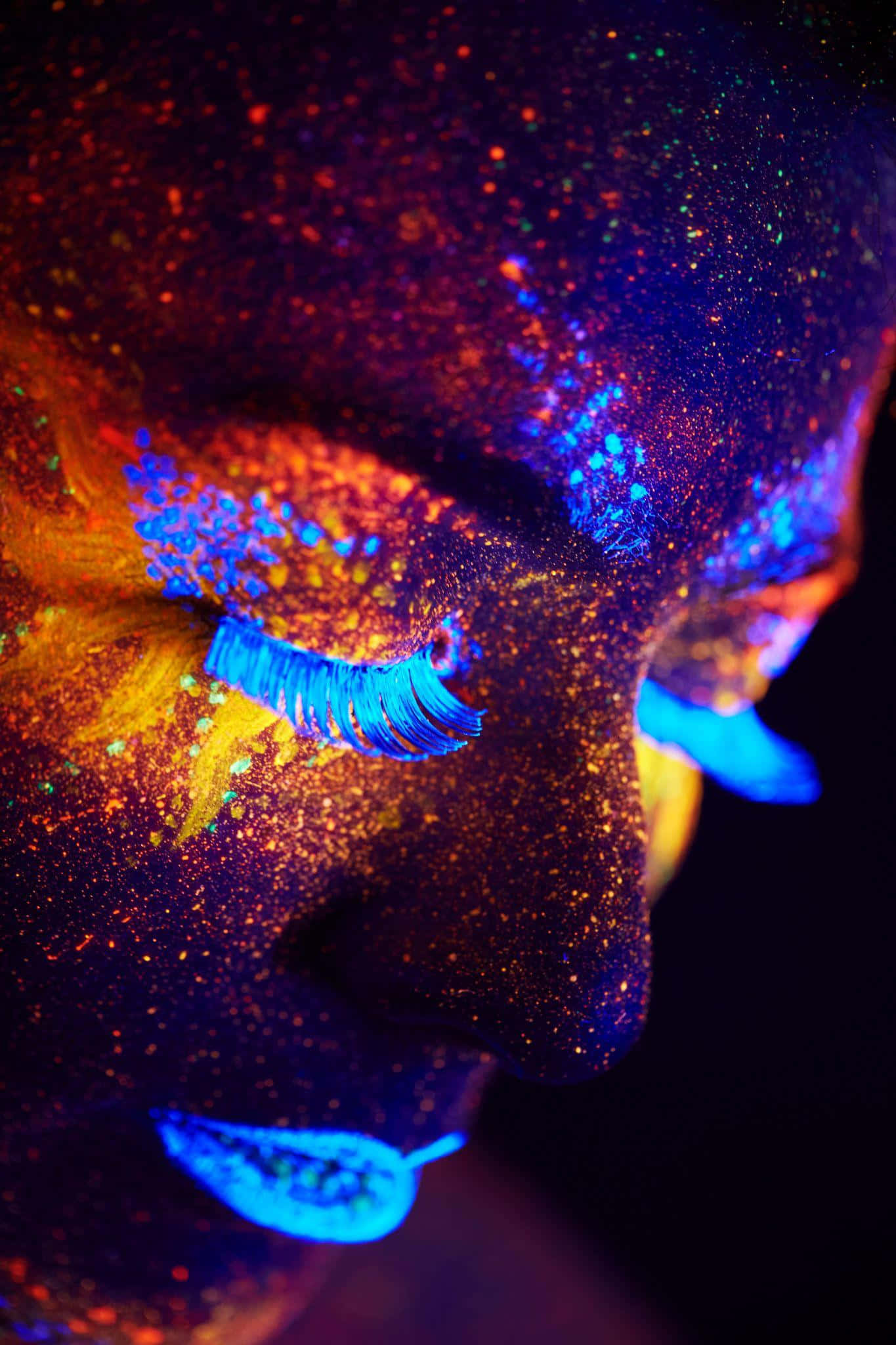 A Vibrant Explosion Of Neon Makeup Under Blacklight. Wallpaper