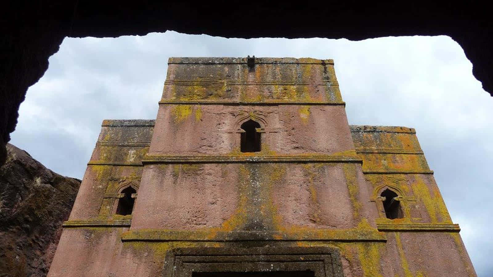 A View Of Lalibela's St. George Church From A Cave Wallpaper