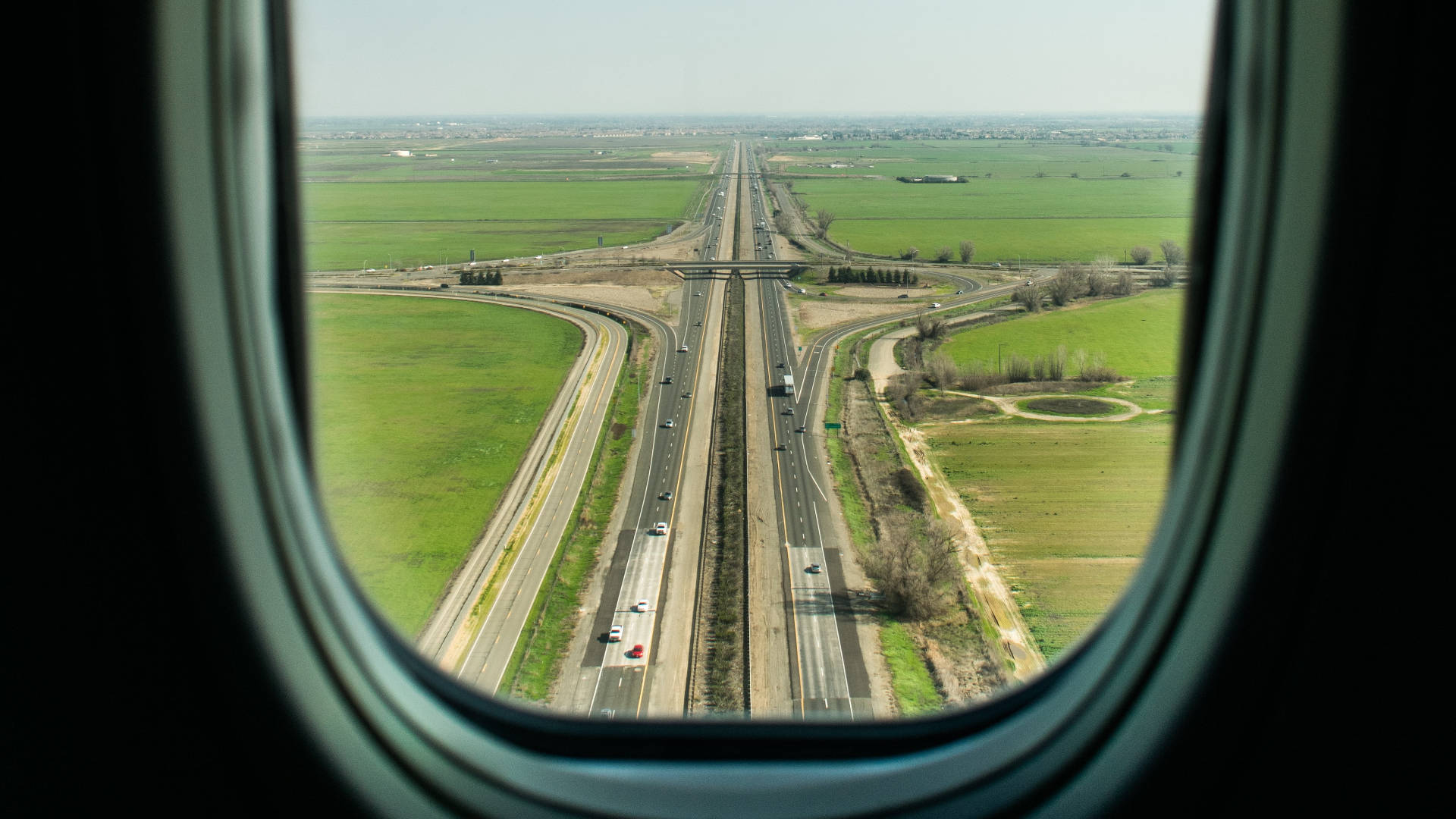 A View Of The Runway From A Plane Window Wallpaper