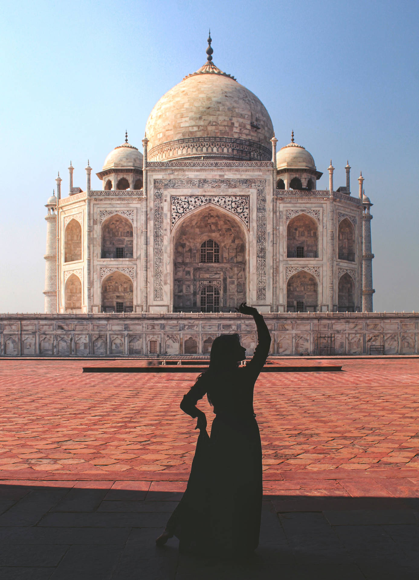 A Woman Dancing In Front Of The Taj Mahal Wallpaper