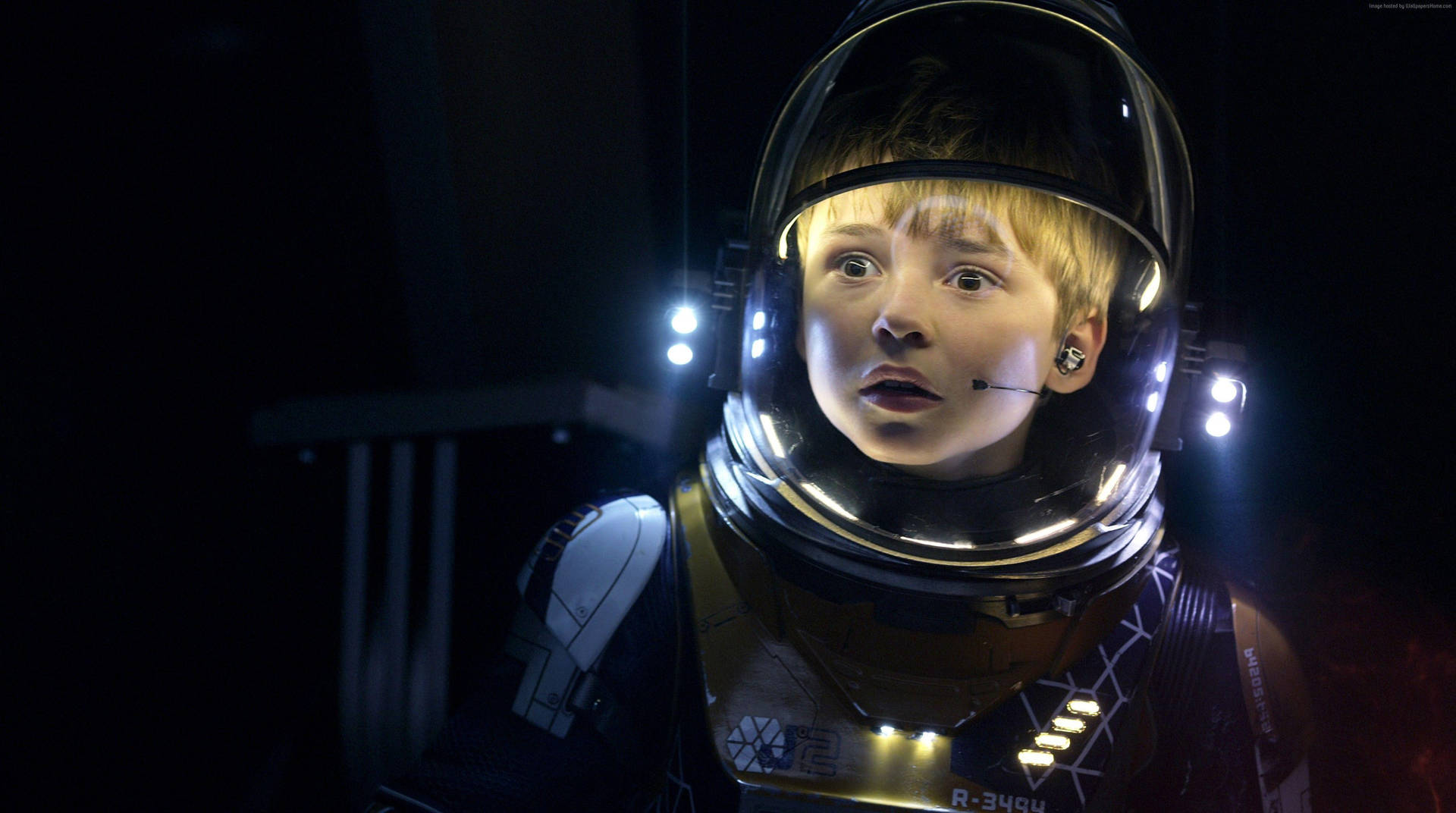 A Young Boy In Lost In Space Wallpaper