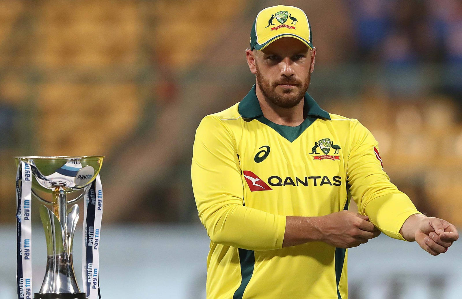 Aaron Finch Triumphantly Holds Championship Trophy Wallpaper