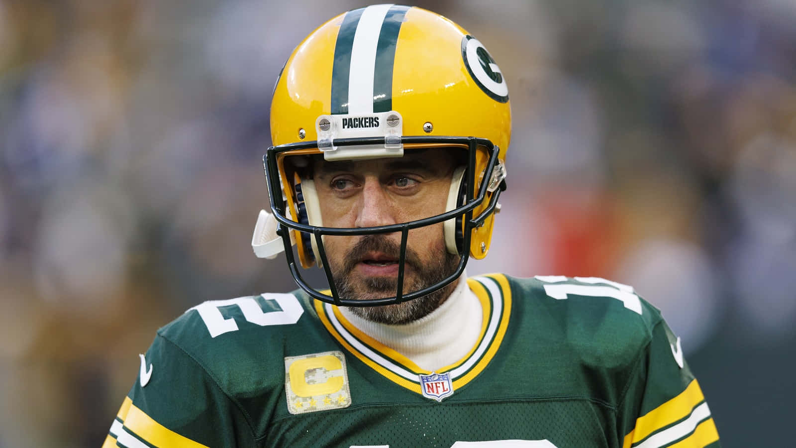 A Green Bay Packers Player Is Wearing A Green Uniform