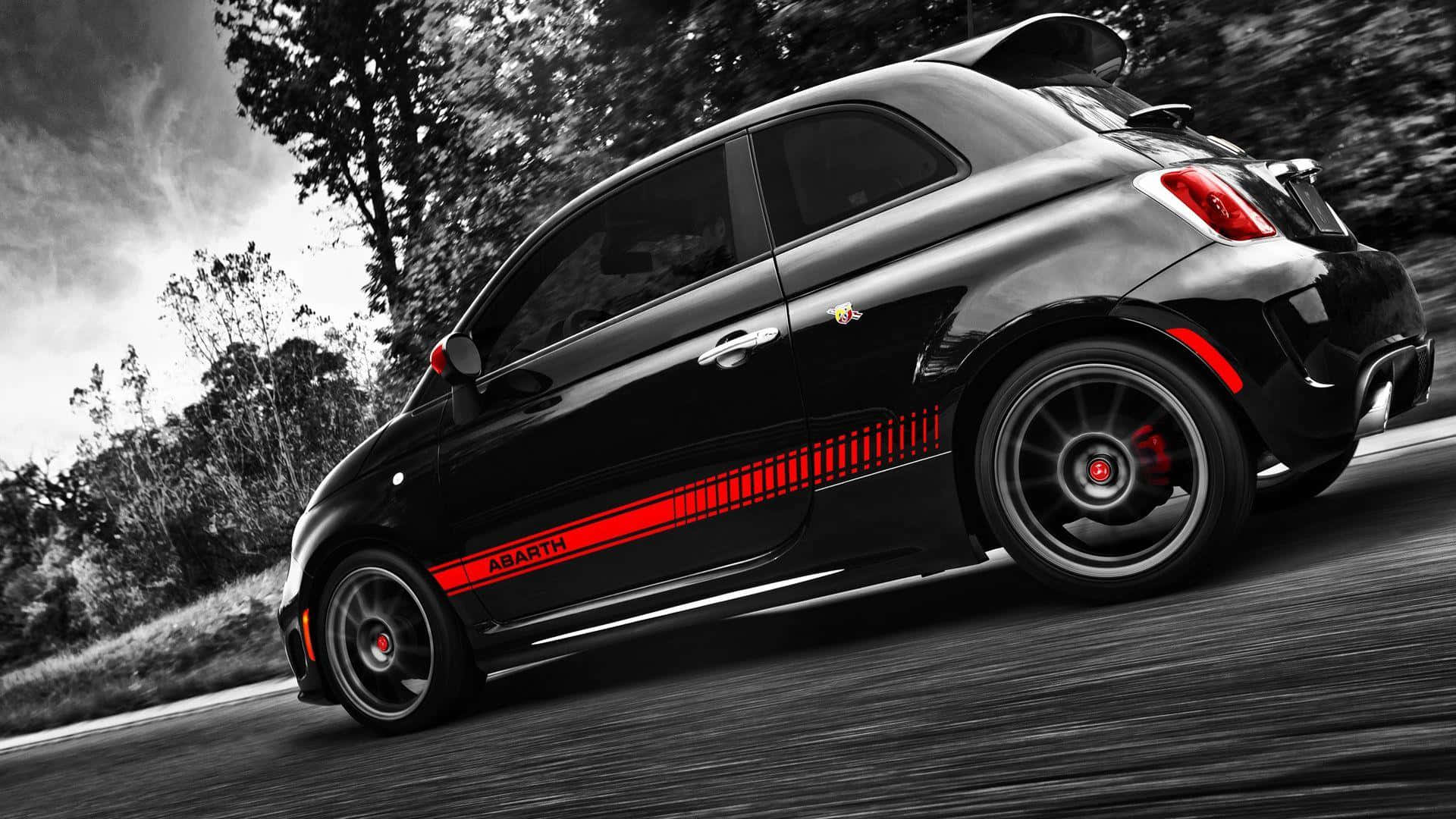 Sleek Abarth Sports Car on the Road Wallpaper