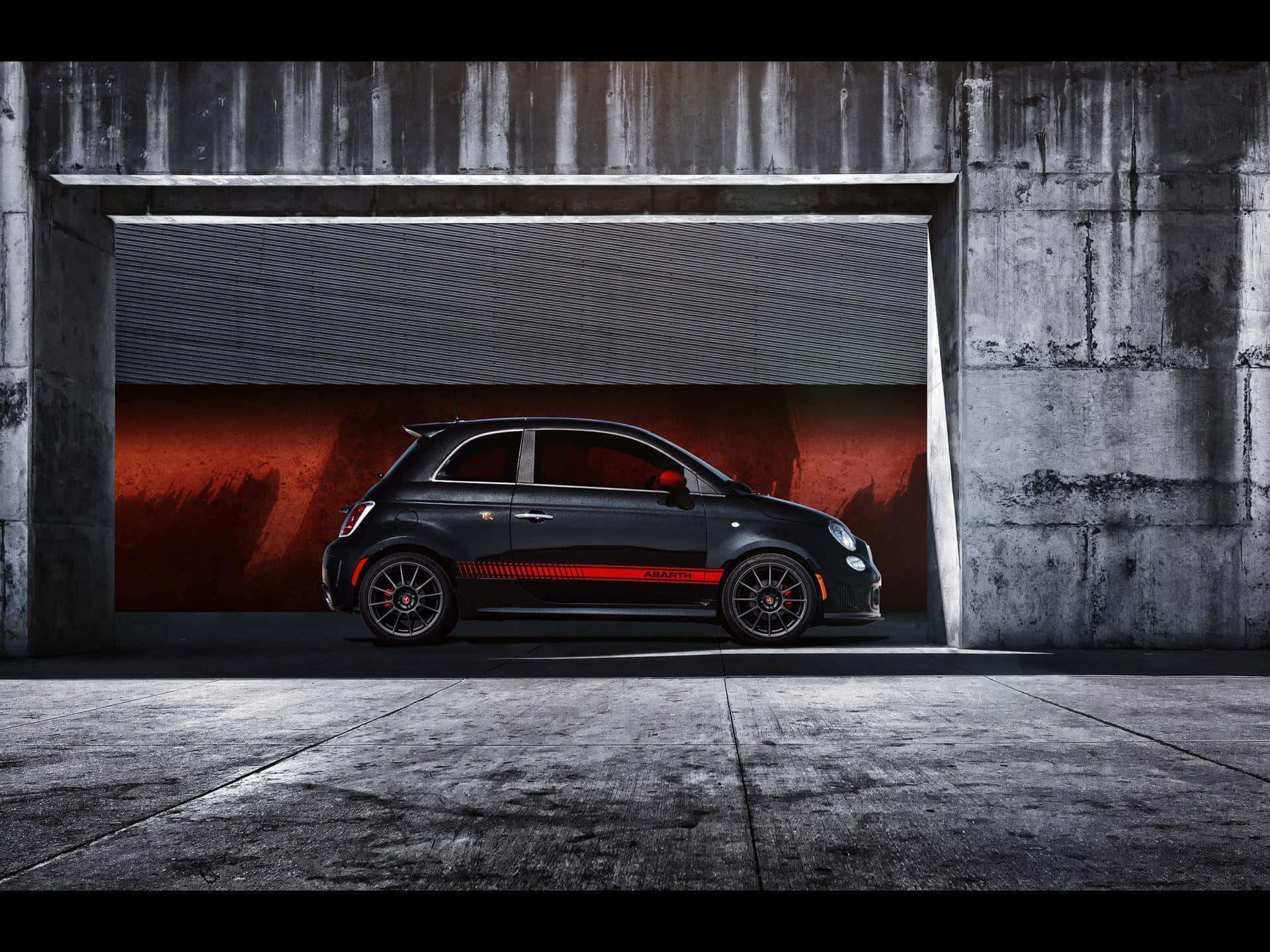 Abarth sports car showcased in landscape setting Wallpaper