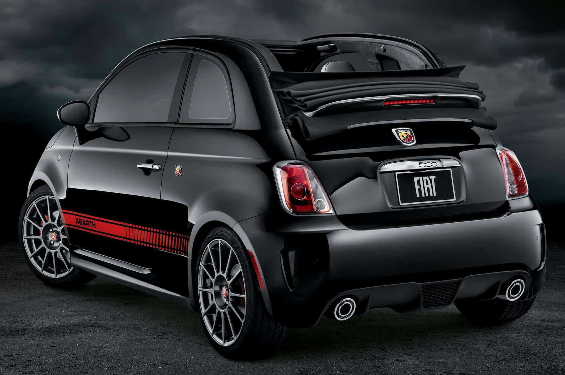 A fiery red Abarth sports car on the move Wallpaper