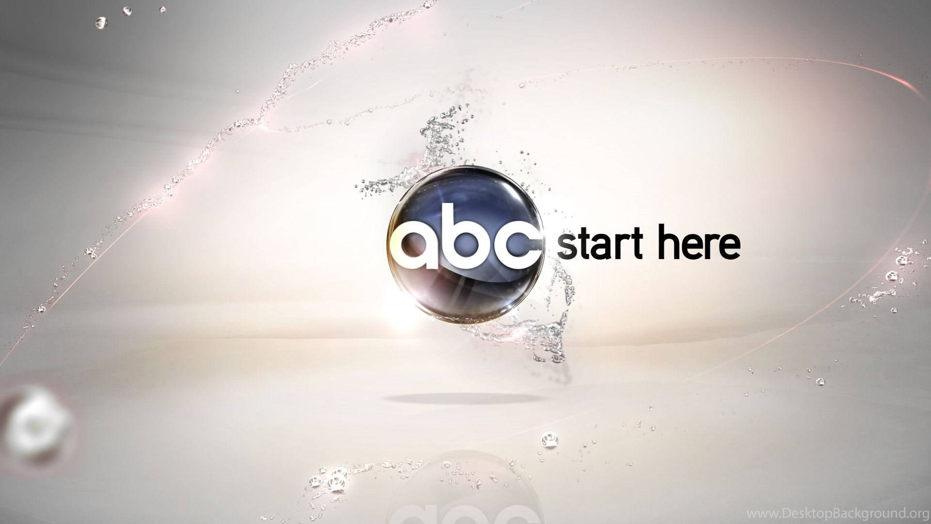 Vibrant ABC Logo Immersed in a Water Splash Effect Wallpaper