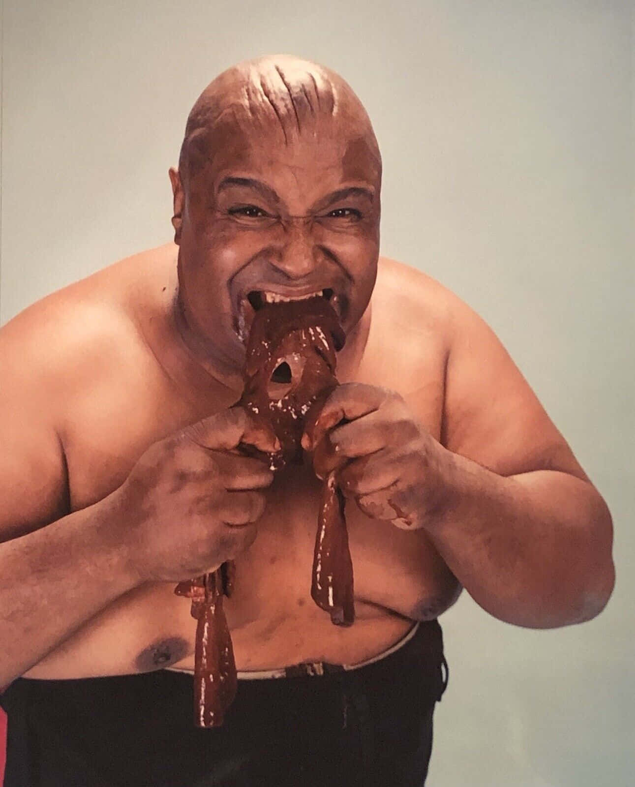 Iconic wrestling legend, Abdullah The Butcher intimidating in poster. Wallpaper