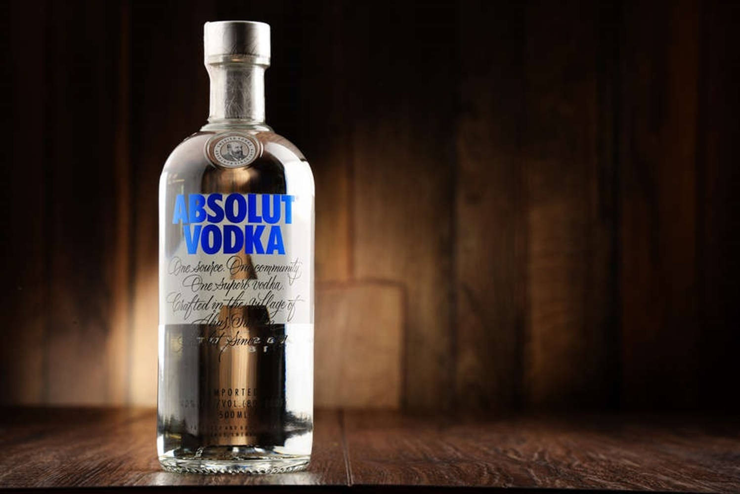 Absolut Vodka Bottle In Dark Room Wallpaper
