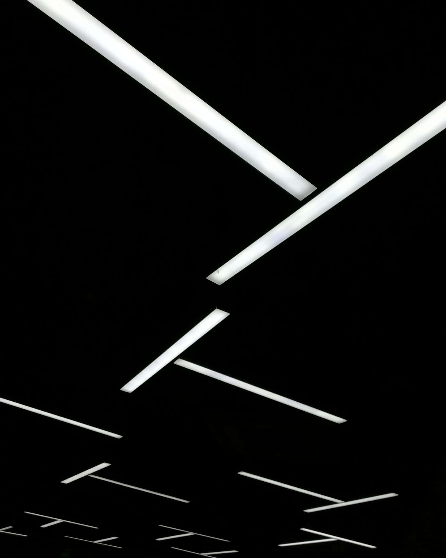 Abstract Fluorescent Lights Against Black Background Wallpaper