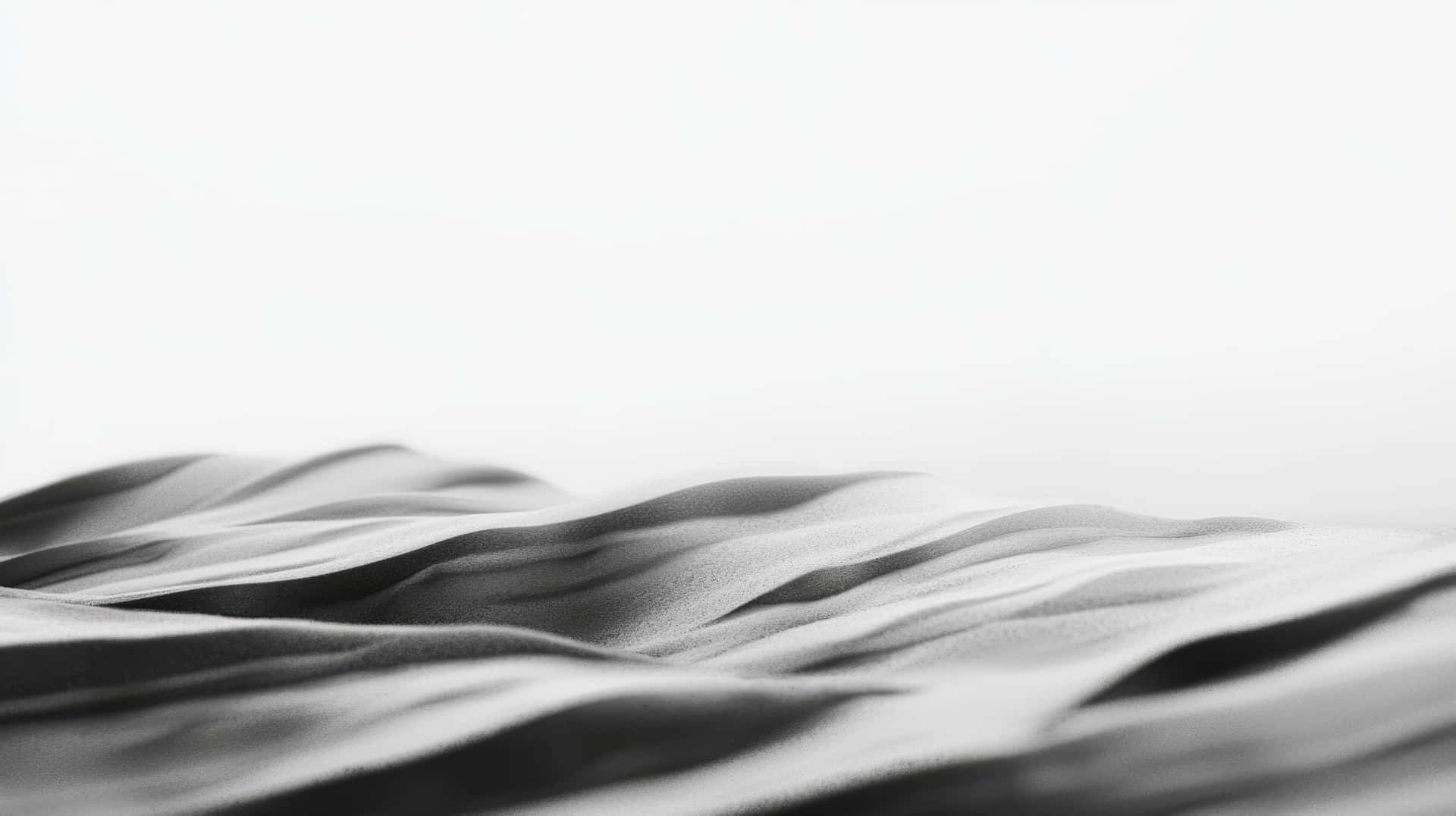 Abstract Monochrome Sand Dunes With Soft Curves And Gentle Light Shadows Wallpaper
