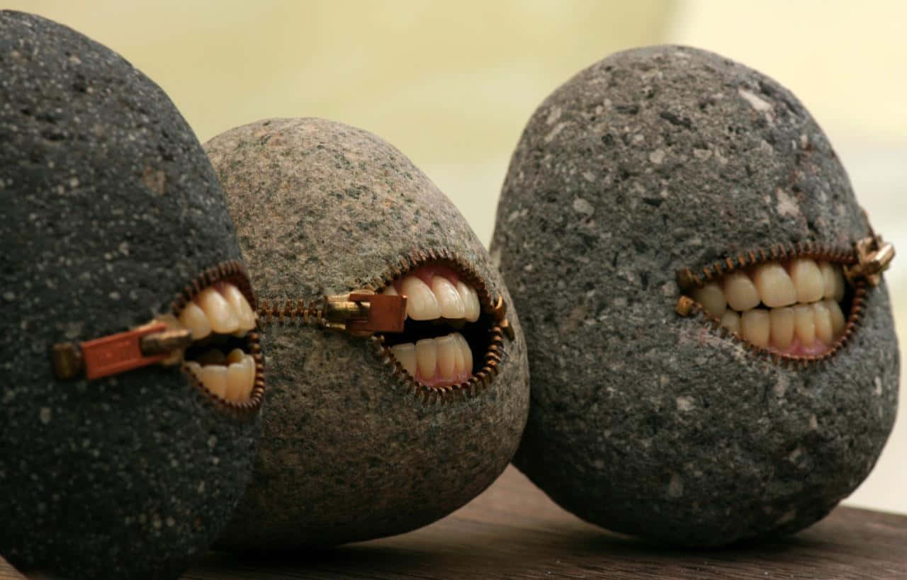 Absurd Rocks With Mouths Wallpaper
