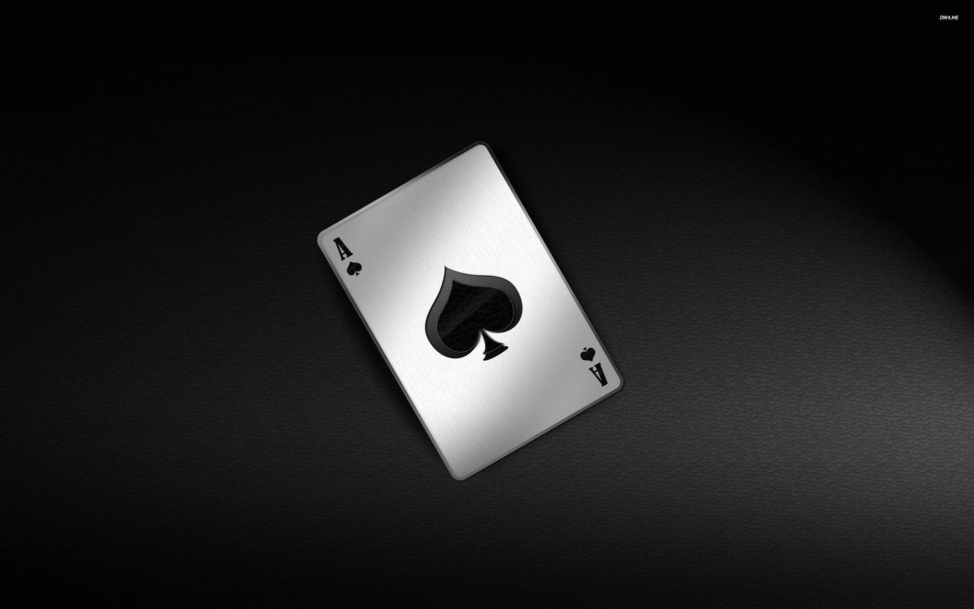 Eineschwarze Und Silberne Spielkarte Auf Einem Schwarzen Hintergrund. Wallpaper