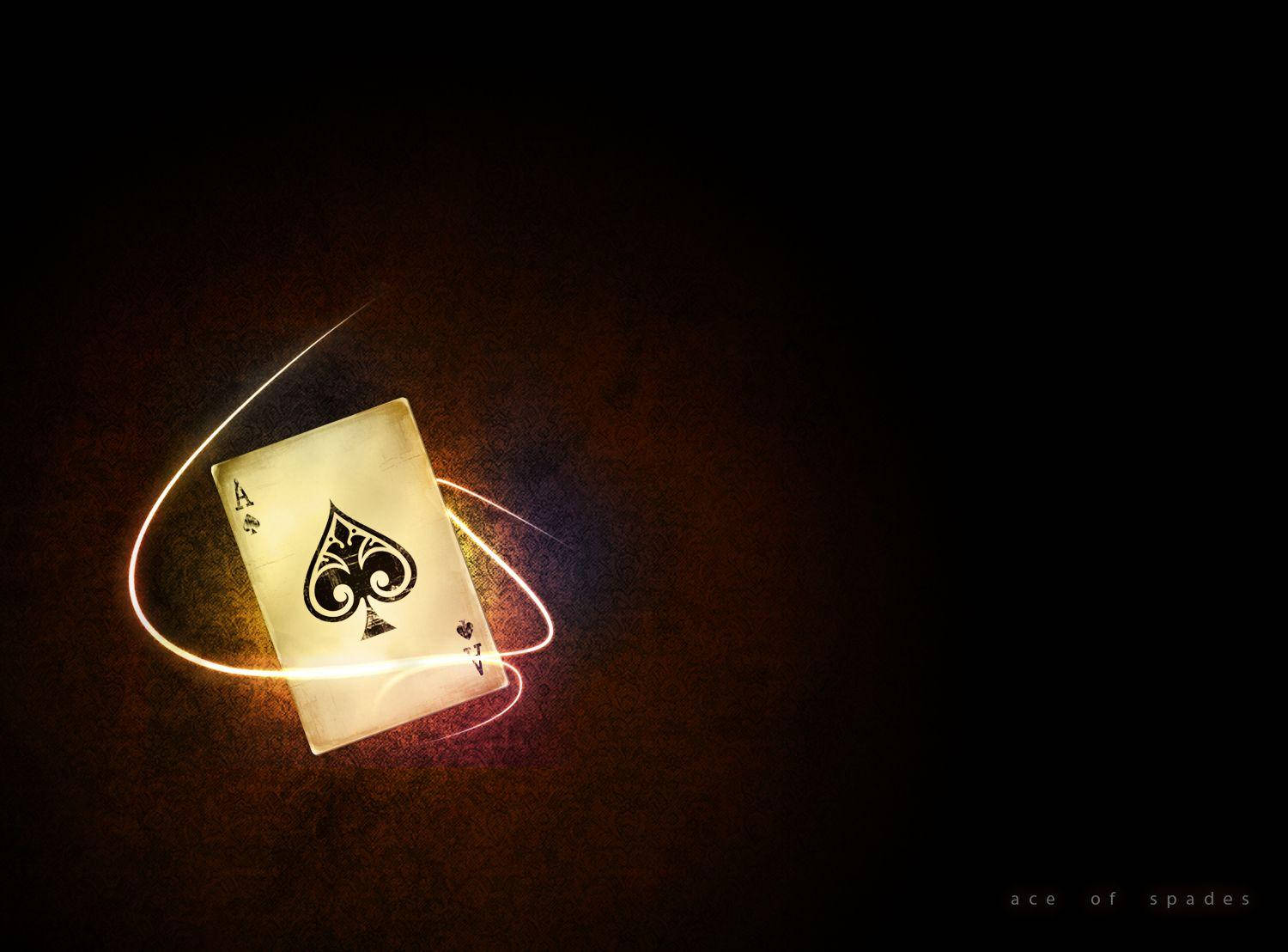 A Playing Card With A Light Shining On It Wallpaper