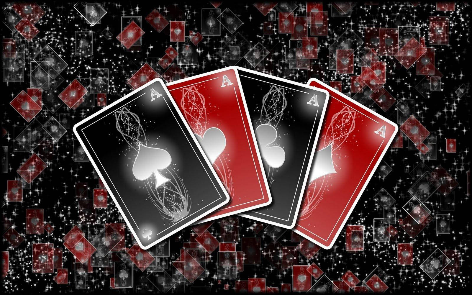 A Black Background With Playing Cards On It Wallpaper