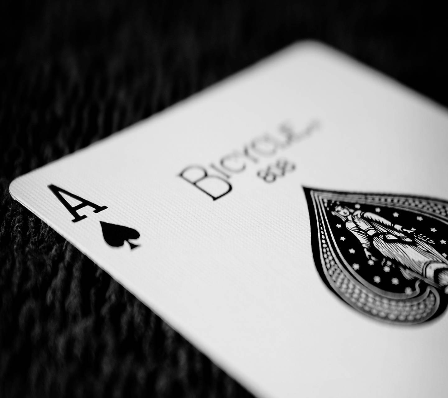 A Black And White Photo Of A Playing Card Wallpaper