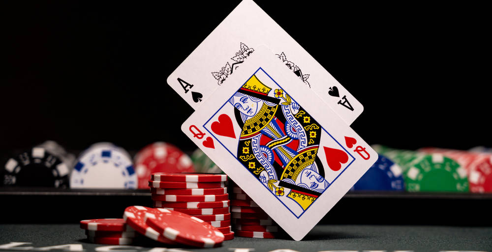 Ace Queen Balancing Blackjack Cards Wallpaper