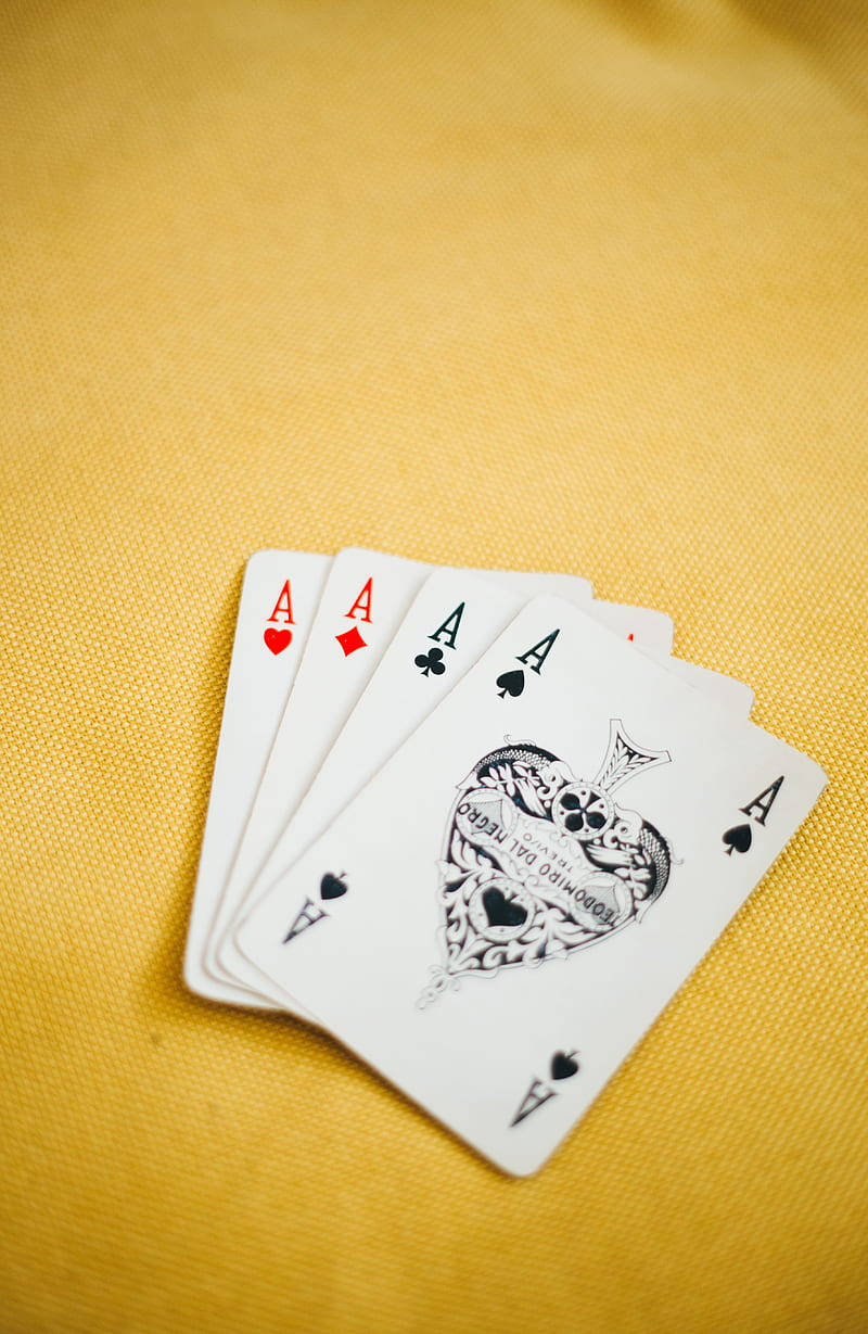 Ace Rummy Cards On Yellow Backdrop Wallpaper