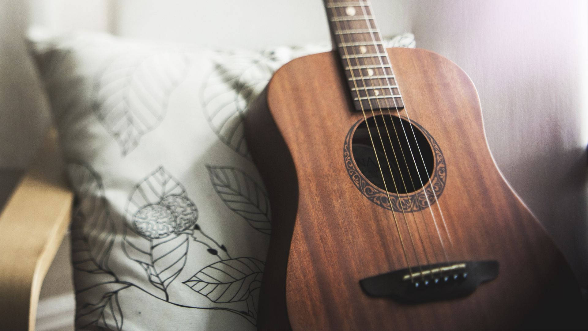 Acoustic Guitar With Pillow Wallpaper