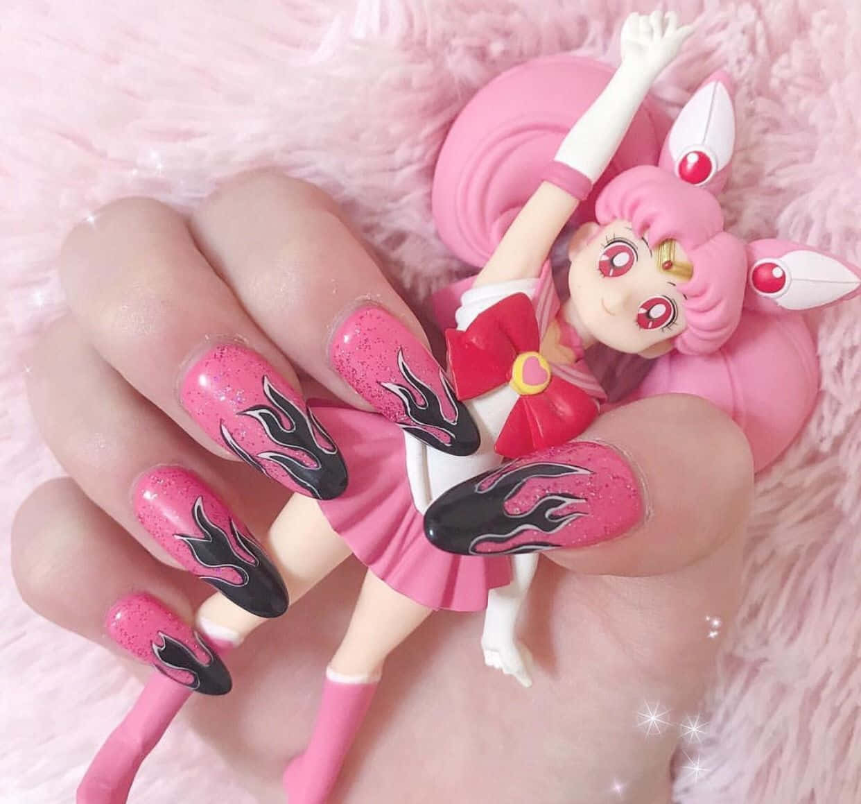 A Girl Holding A Pink Sailor Moon Doll Wallpaper