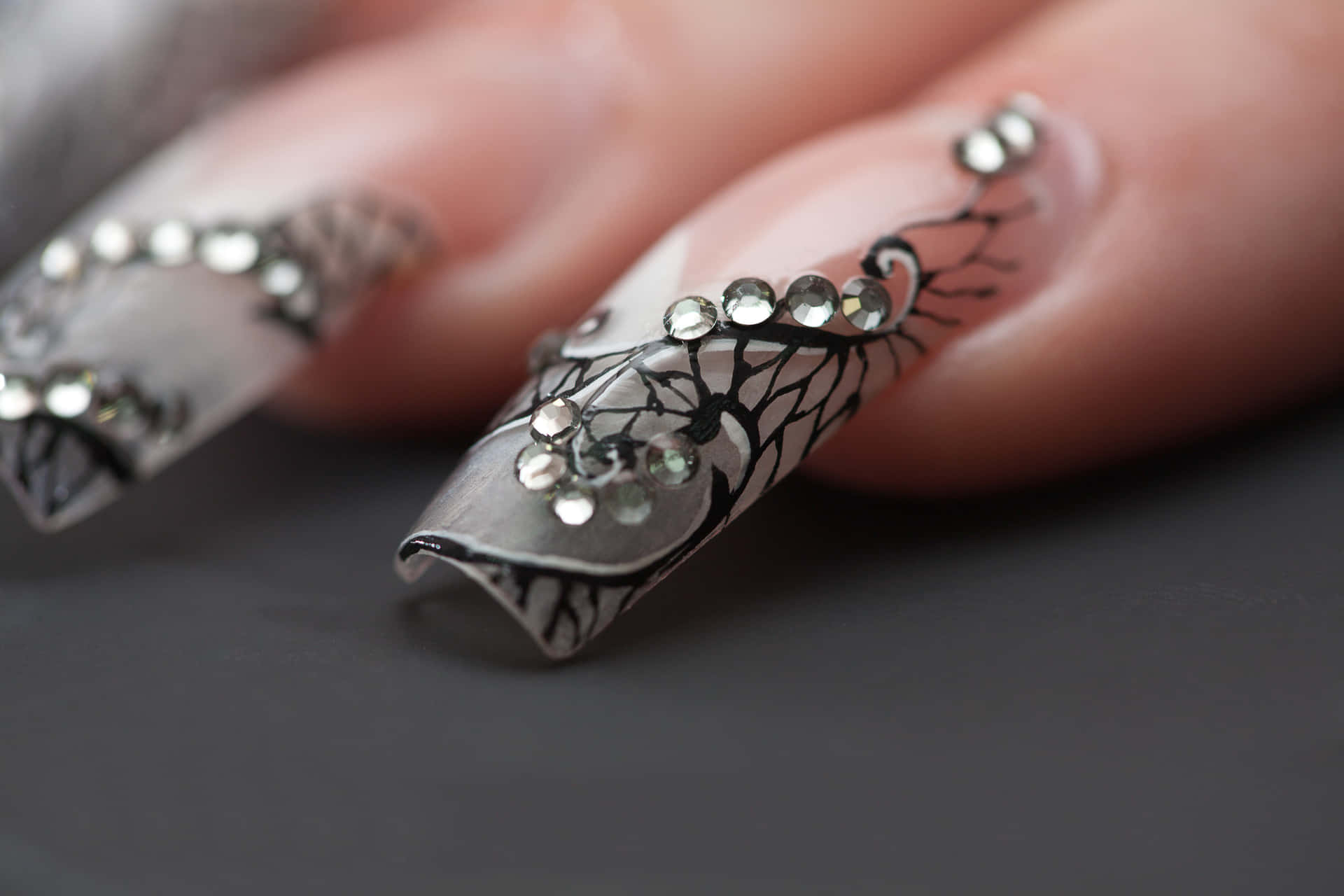 A Woman's Nails With A Lot Of Bling Wallpaper